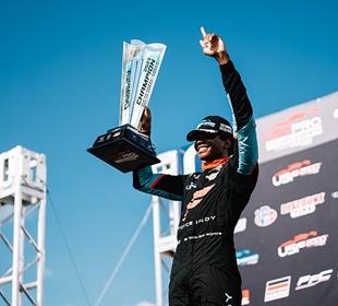 Rowe Makes Racing History, Continues Climb with Title